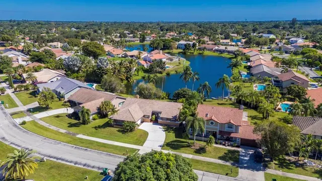 an aerial view of a house with a swimming pool yard and outdoor seating