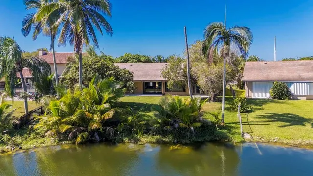 a front view of a house with a swimming pool