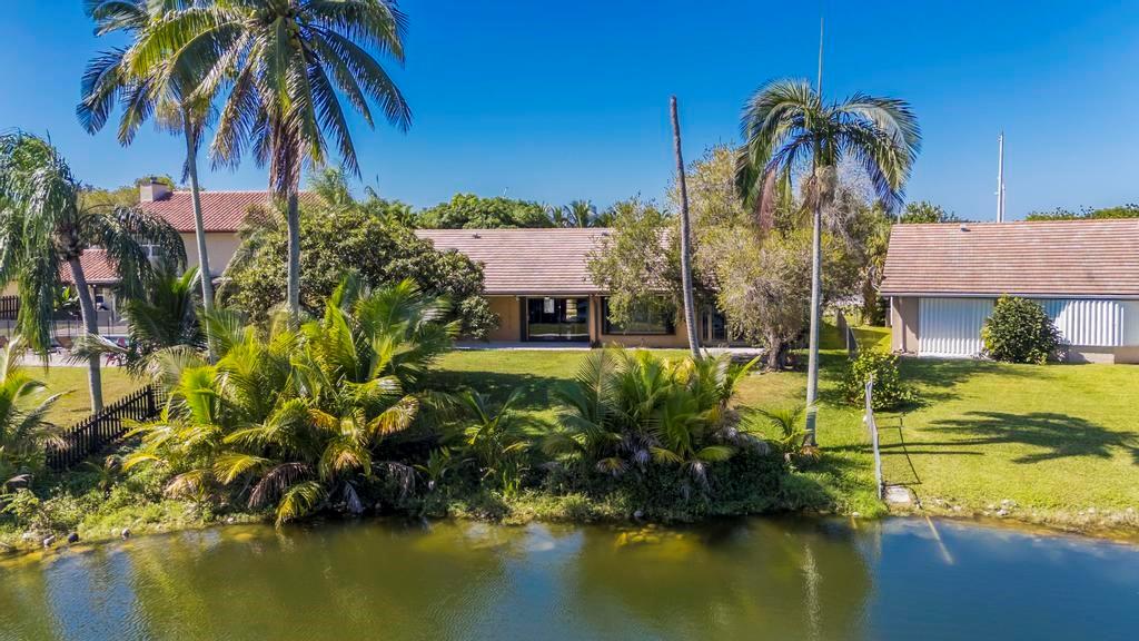 5720 West Waterford Drive Davie, FL 33331 - Photo 5 of 25 a front view of a house with a swimming pool