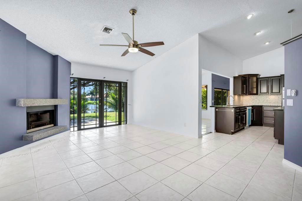 5720 West Waterford Drive Davie, FL 33331 - Photo 6 of 25 a view of a kitchen with furniture and a fireplace