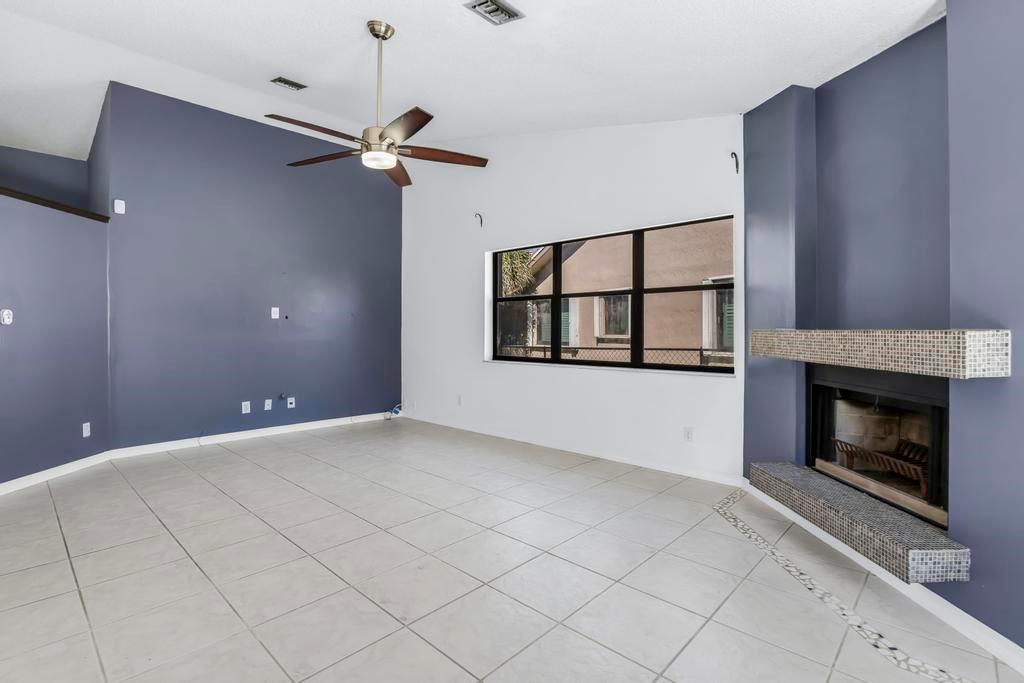 5720 West Waterford Drive Davie, FL 33331 - Photo 7 of 25 a view of empty room with windows and fireplace