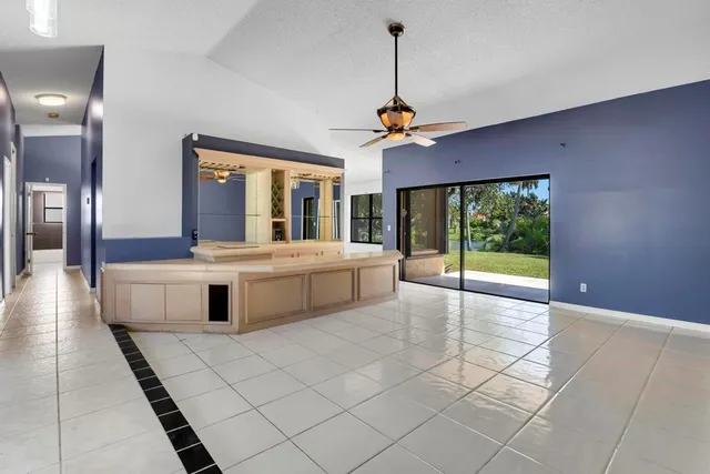 a view of lobby with furniture and chandelier
