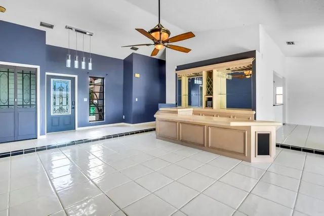 a view of living room with furniture and chandelier