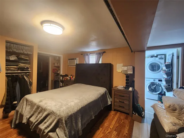 a bed room with a bed and a television
