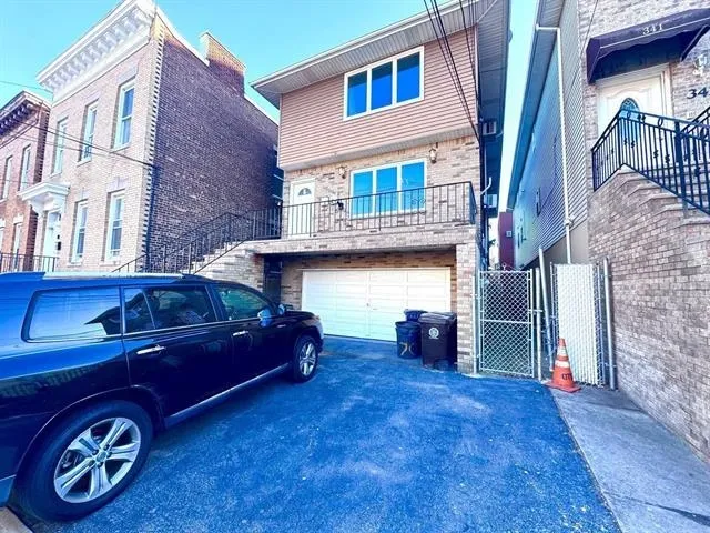 a front view of a house with parking