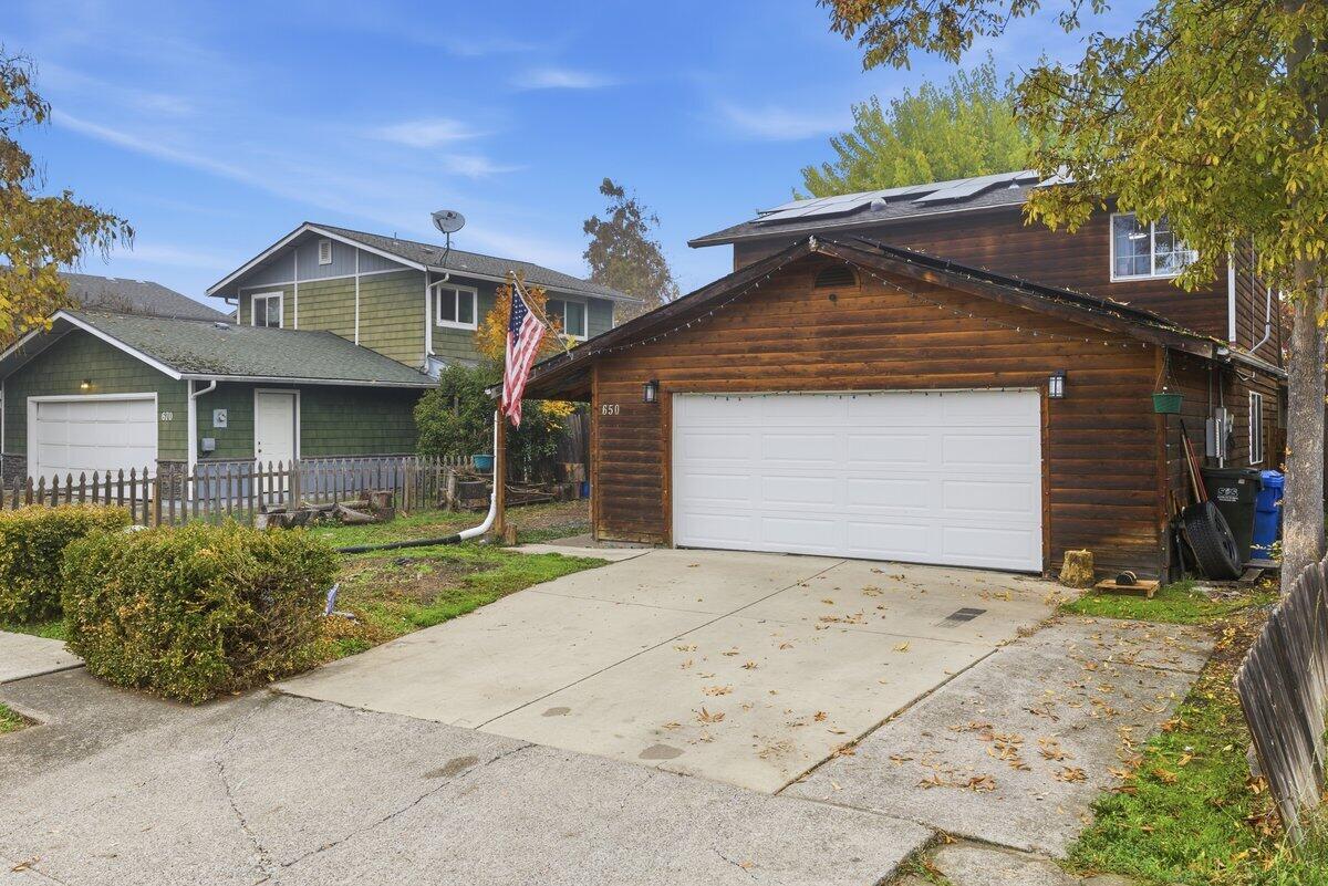 650 Sarah Lane Eagle Point, OR 97524 - Photo 2 of 19 a front view of a house with a yard and garage