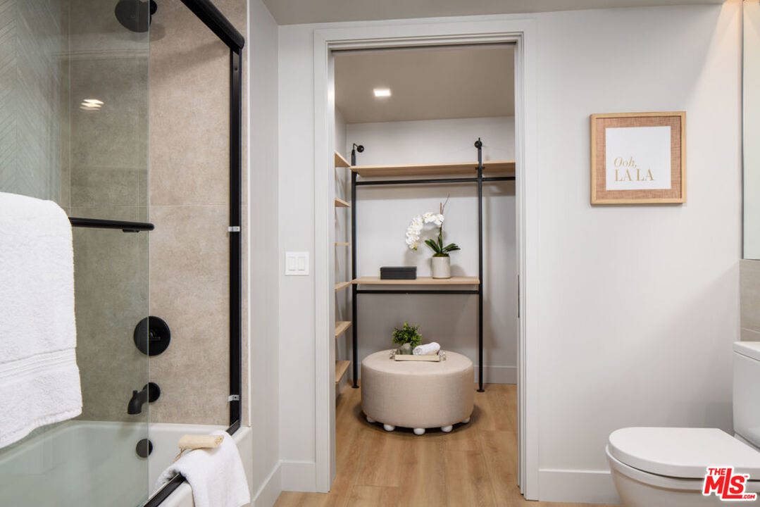 12431 Rochester Avenue, Unit PH4 Los Angeles, CA 90025 - Photo 12 of 28 a bathroom with a sink and a mirror