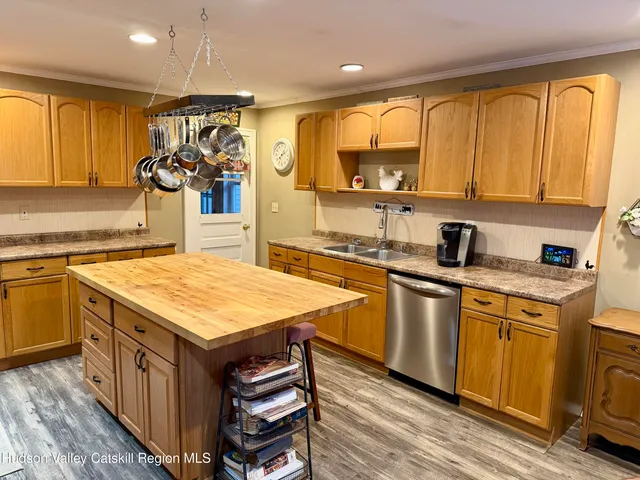 a kitchen with a stove a sink and a refrigerator