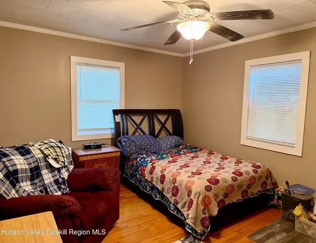 a bedroom with a bed and window