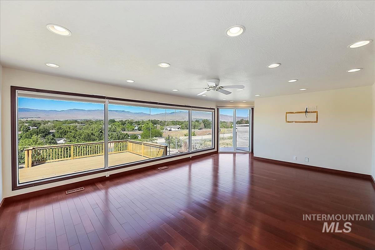 2804 West Sunrise Rim Road Boise, ID 83705 - Photo 19 of 50 Expansive interior space featuring wood-finish flooring, recessed lighting, and a ceiling fan