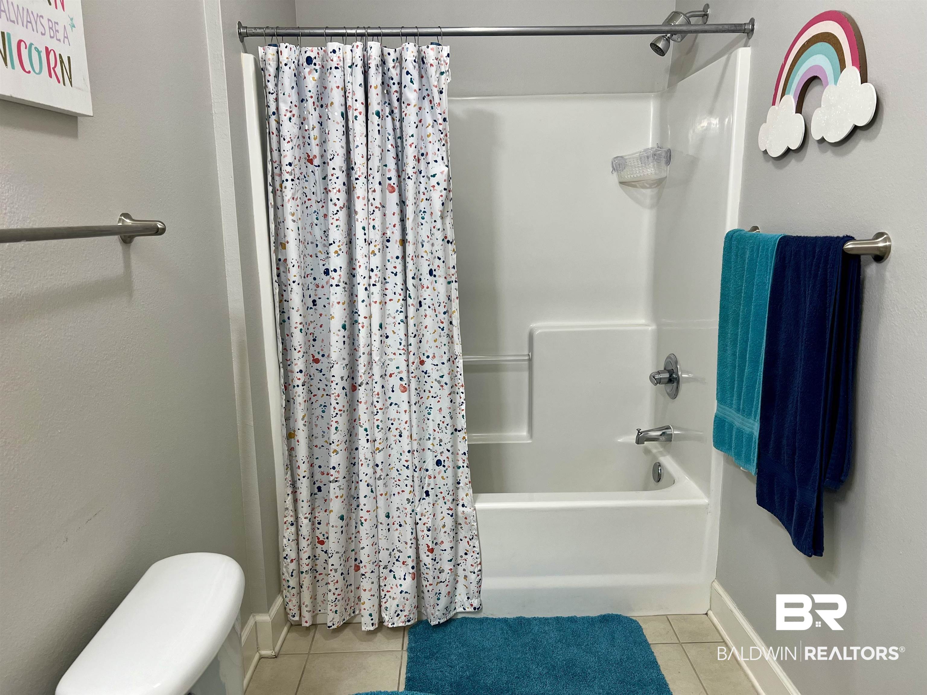 450 Park Avenue, Unit 808 Foley, AL 36535 - Photo 19 of 38 Bathroom with tile patterned flooring, toilet, and shower / bath combo with shower curtain