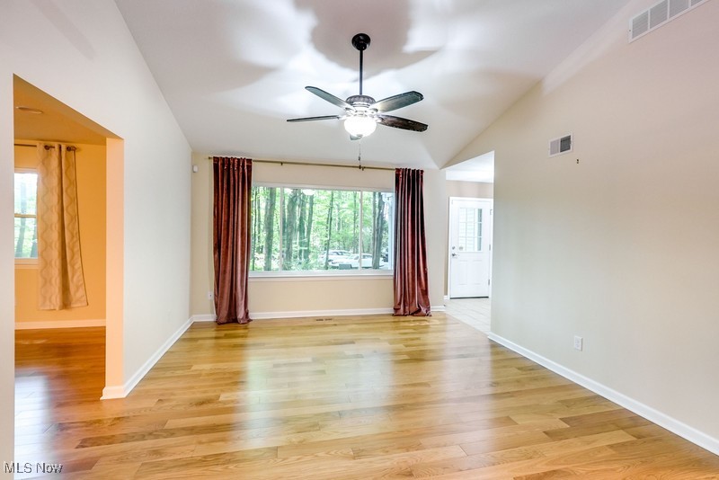 8648 Taylor May Road Chagrin Falls, OH 44023 - Photo 13 of 37 Spare room featuring light wood-type flooring, ceiling fan, and vaulted ceiling