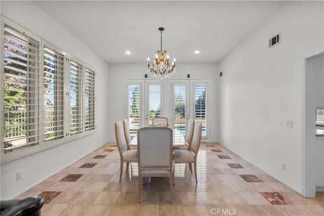 a large kitchen with stainless steel appliances granite countertop a large counter top and a stove top oven