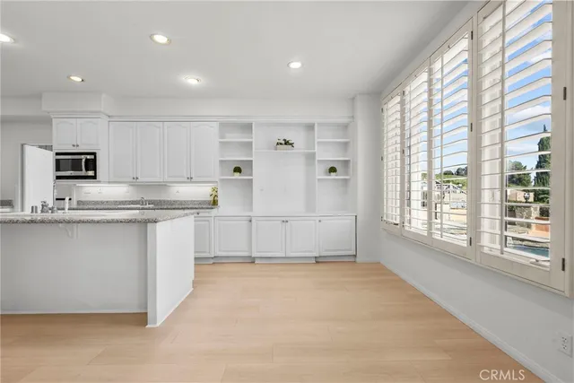 a view of an empty room with a fireplace