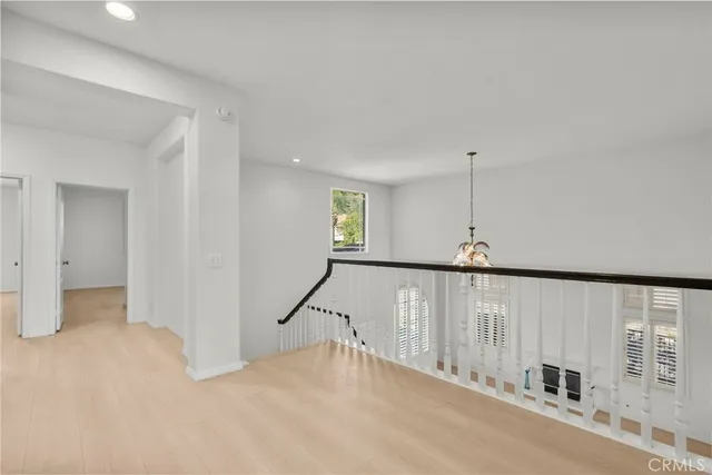 a view of a big room with windows and cabinet