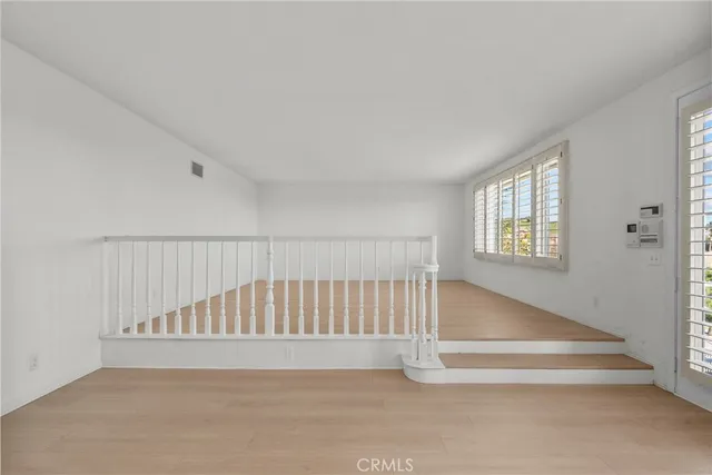 a spacious bathroom with a tub sink double vanity and windows