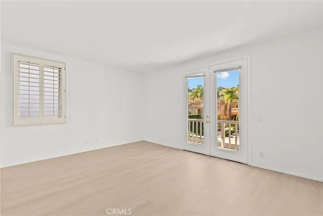a view of a swimming pool with a patio and plants
