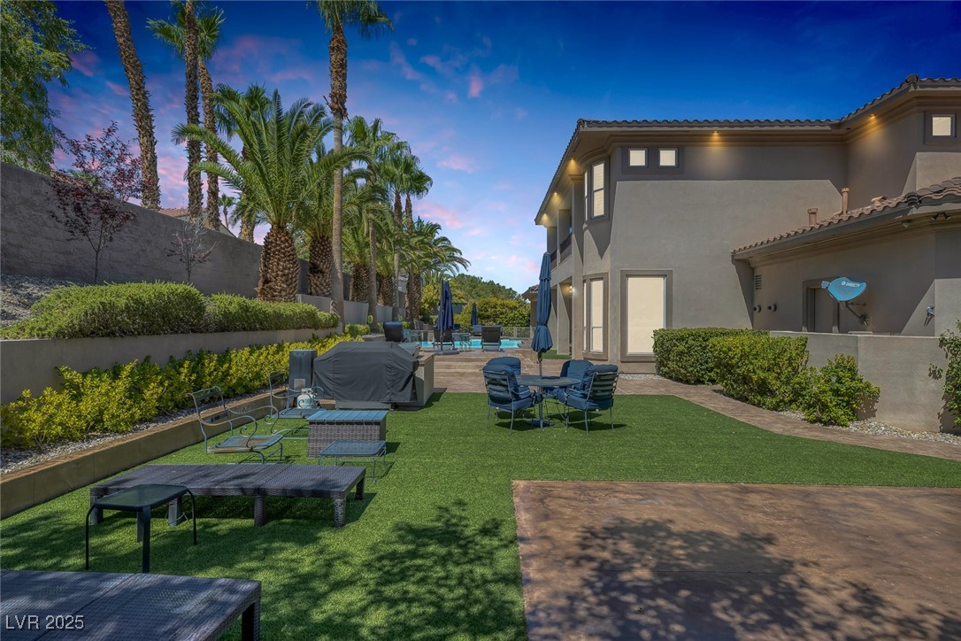 1545 Villa Rica Drive Henderson, NV 89052 - Photo 38 of 61 Yard at dusk with a patio