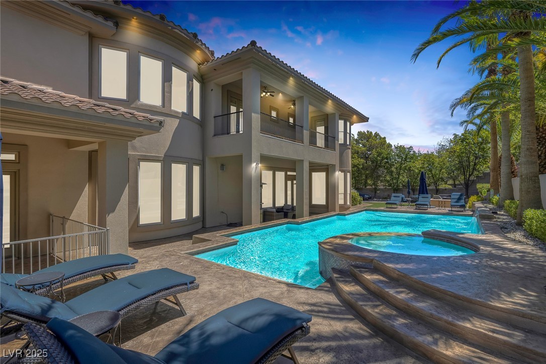 1545 Villa Rica Drive Henderson, NV 89052 - Photo 40 of 61 View of swimming pool featuring a pool with connected hot tub and a patio