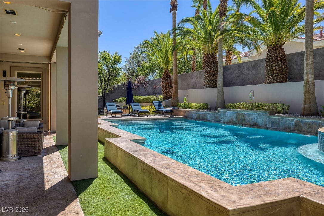 1545 Villa Rica Drive Henderson, NV 89052 - Photo 48 of 61 View of swimming pool featuring a fenced backyard and a patio area