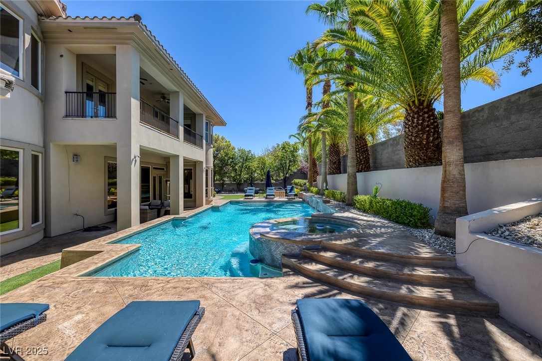 1545 Villa Rica Drive Henderson, NV 89052 - Photo 50 of 61 View of pool with a pool with connected hot tub, a ceiling fan, and a patio area