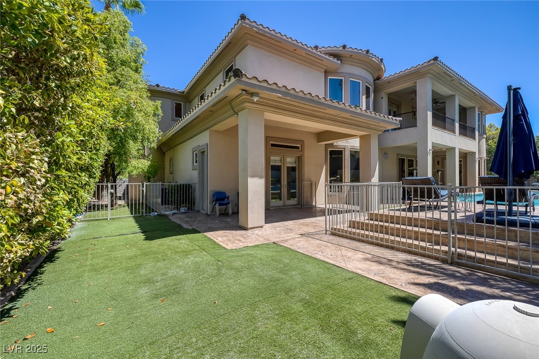 1545 Villa Rica Drive Henderson, NV 89052 - Photo 51 of 61 Back of house featuring a patio area, french doors, stucco siding, a tiled roof, and a balcony