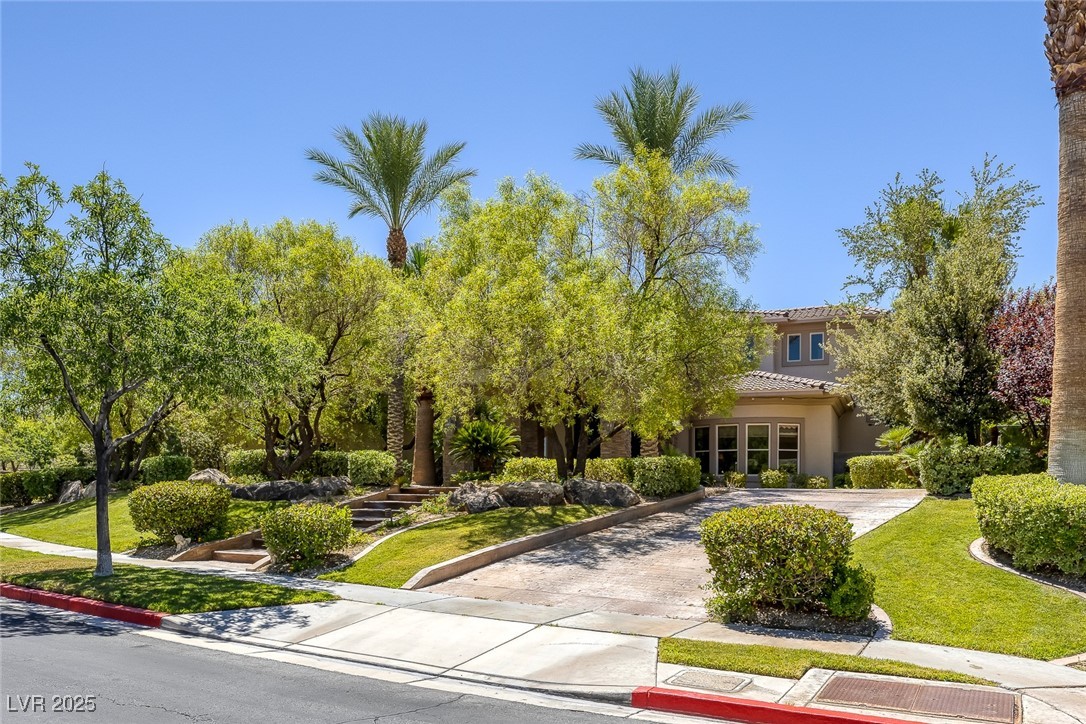 1545 Villa Rica Drive Henderson, NV 89052 - Photo 53 of 61 View of front of property with driveway, a front yard, stucco siding, and a tile roof