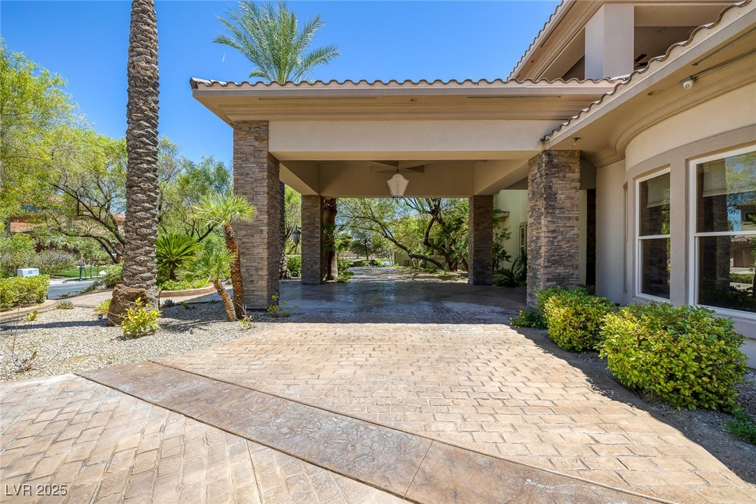 1545 Villa Rica Drive Henderson, NV 89052 - Photo 55 of 61 View of patio featuring curved driveway and a ceiling fan