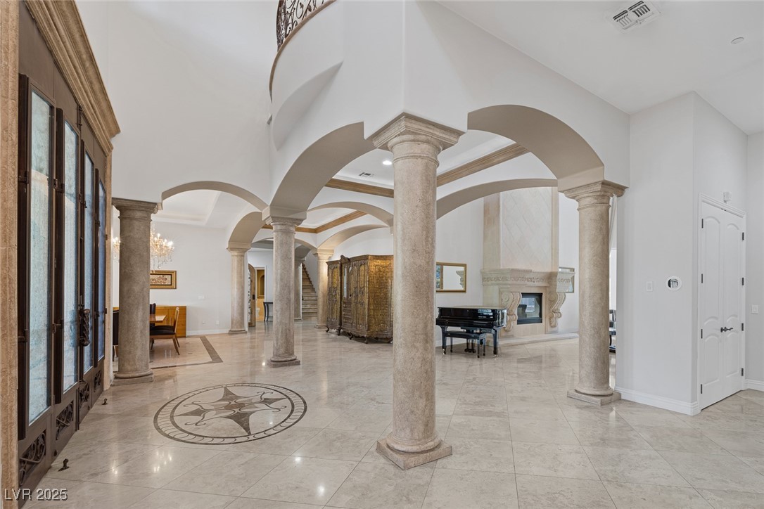 1545 Villa Rica Drive Henderson, NV 89052 - Photo 8 of 61 Lobby featuring a towering ceiling, ornamental molding, and recessed lighting