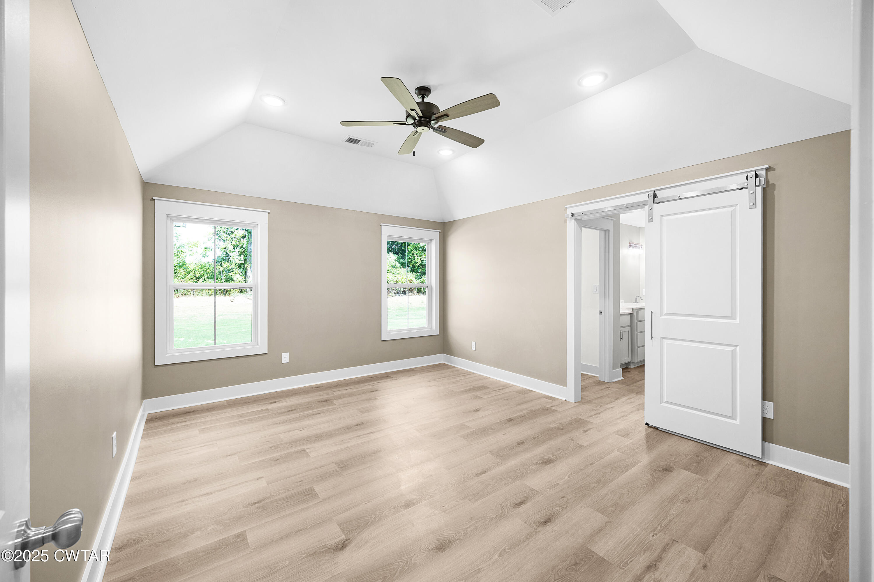 36 Grande Pnes Cove Jackson, TN 38305 - Photo 13 of 23 wooden floor in an empty room with a window