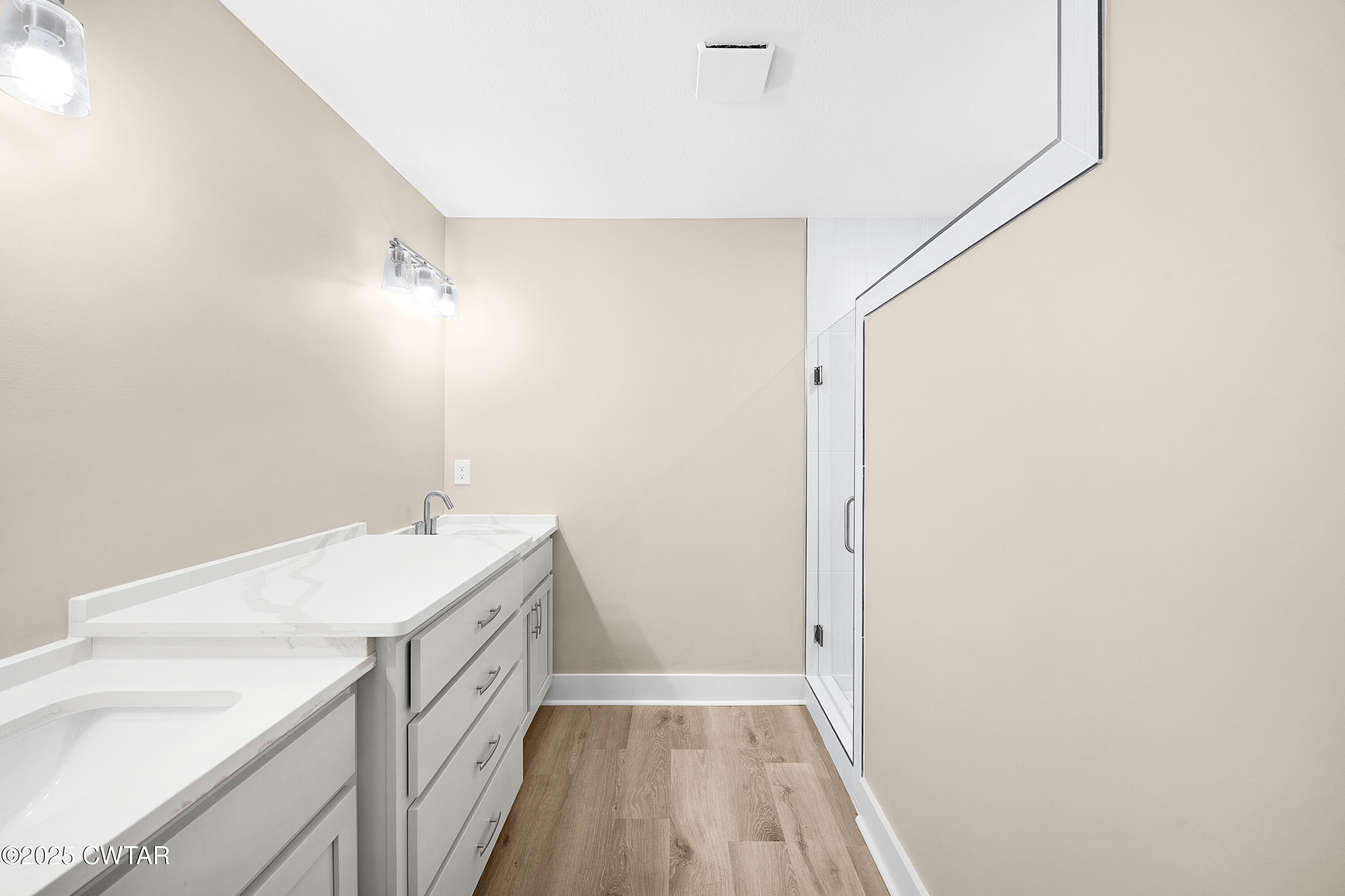 36 Grande Pnes Cove Jackson, TN 38305 - Photo 14 of 23 a bathroom with a sink a vanity and a mirror