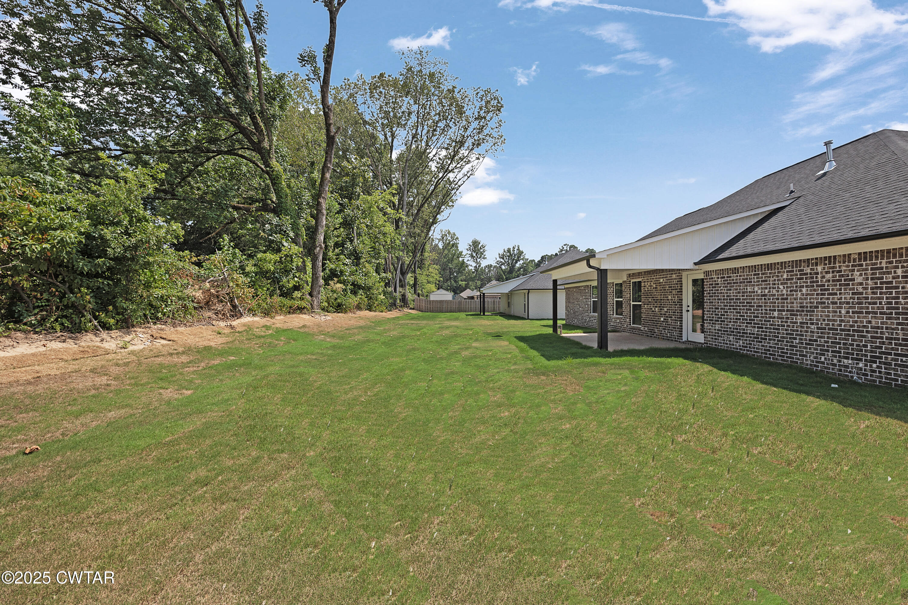 36 Grande Pnes Cove Jackson, TN 38305 - Photo 21 of 23 a backyard of a house with lots of green space