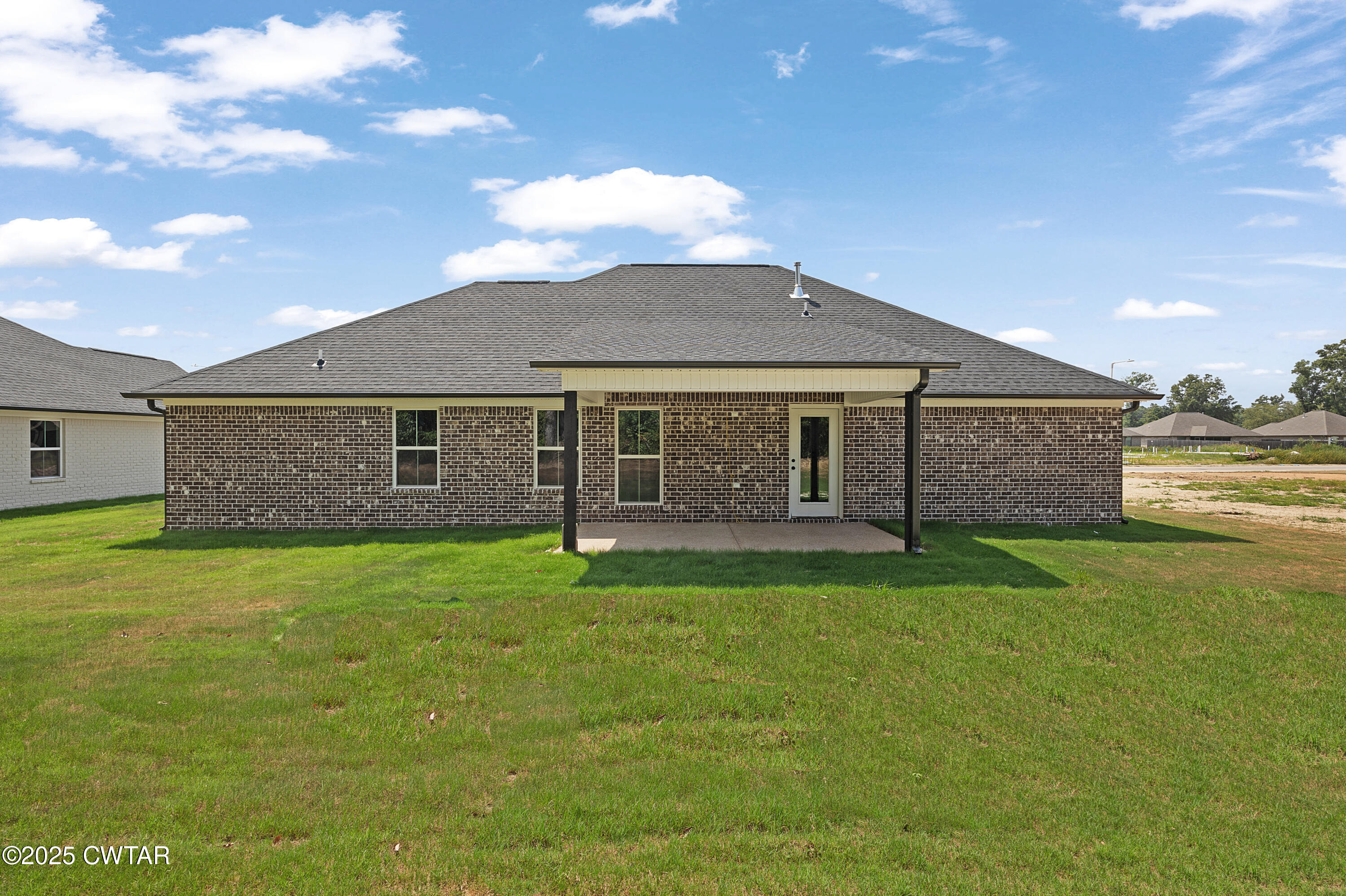 36 Grande Pnes Cove Jackson, TN 38305 - Photo 22 of 23 a front view of a house with a garden