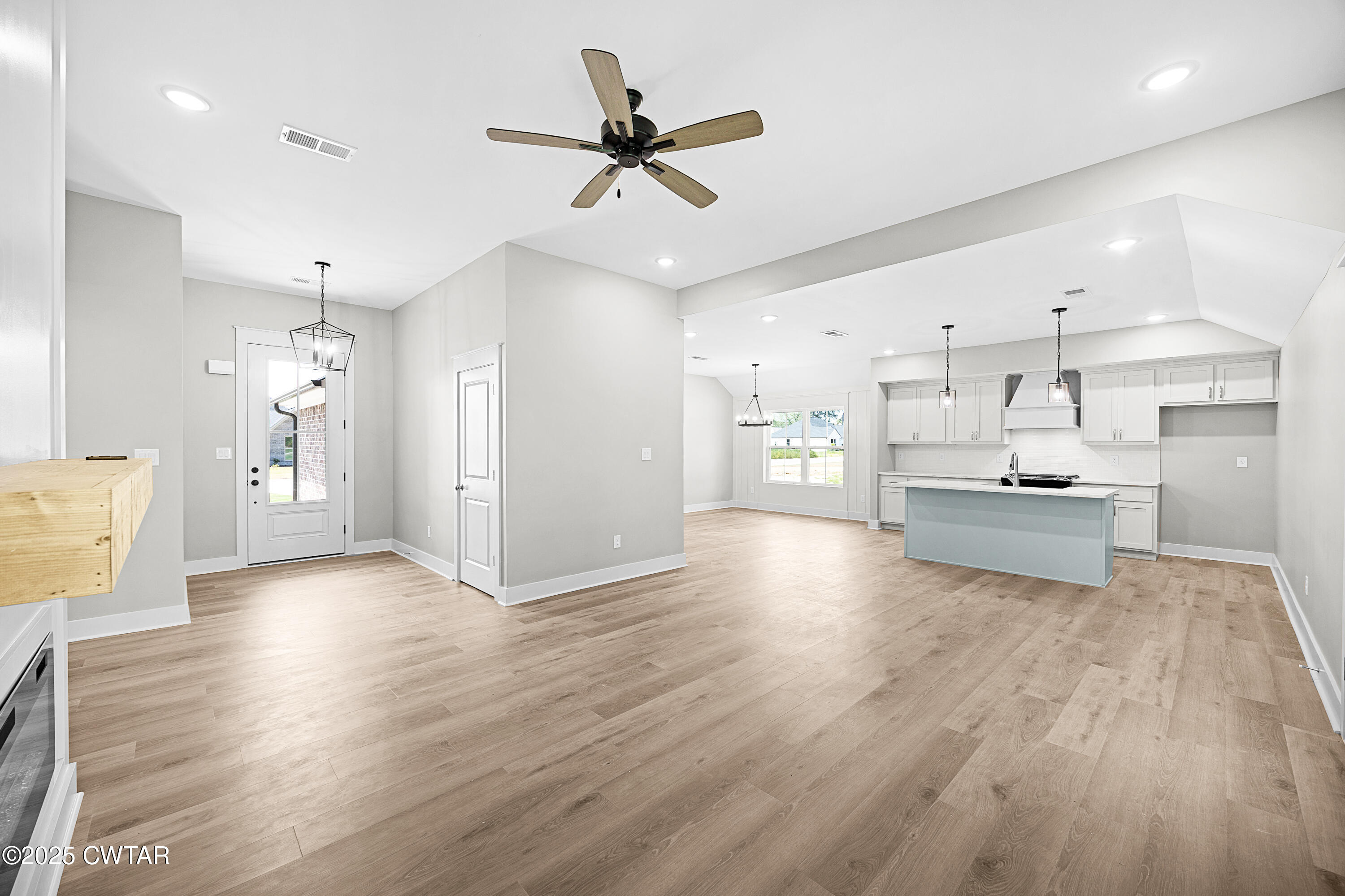 36 Grande Pnes Cove Jackson, TN 38305 - Photo 3 of 23 a view of kitchen with stainless steel appliances kitchen island hardwood floor and a sink