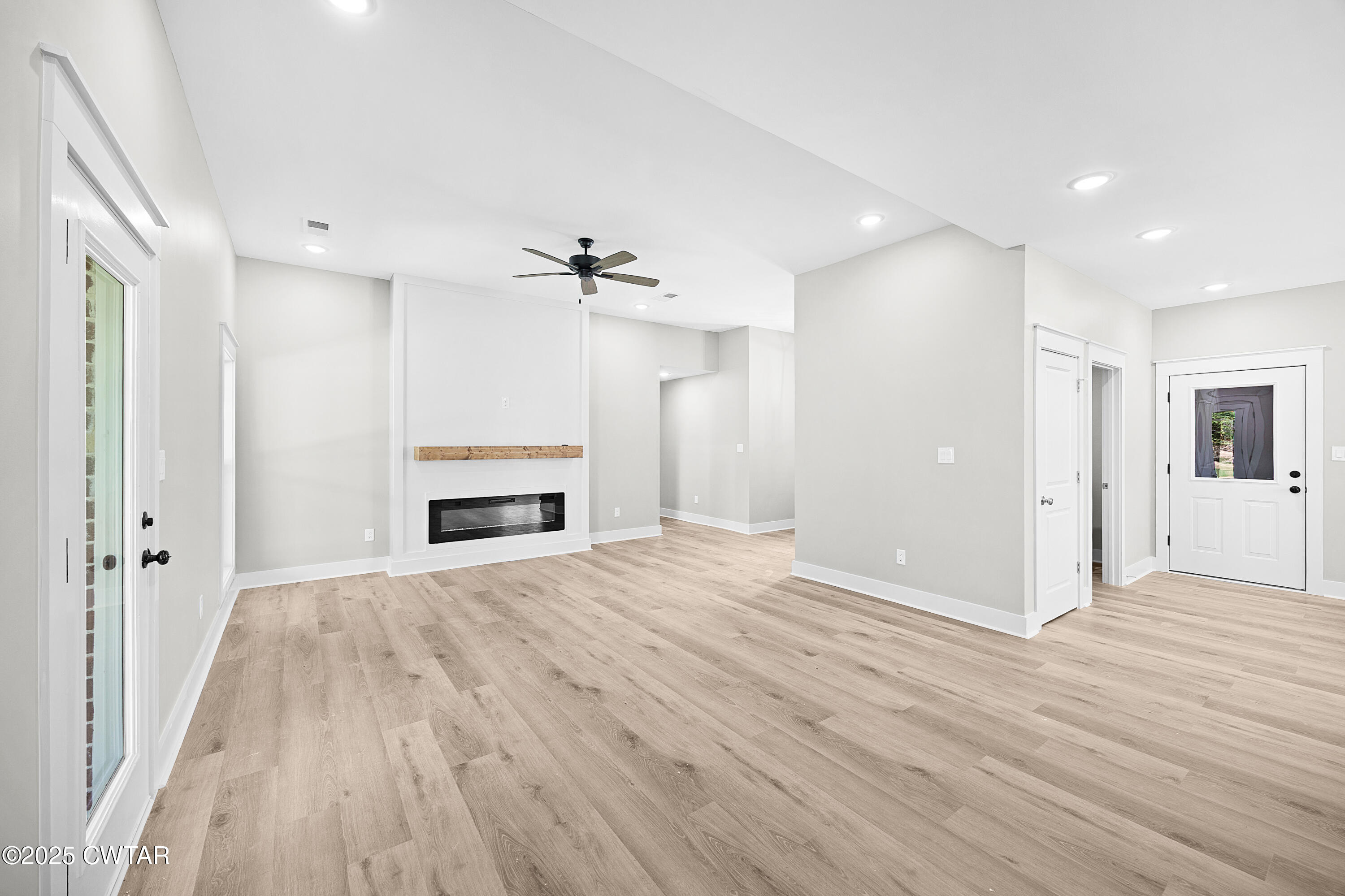 36 Grande Pnes Cove Jackson, TN 38305 - Photo 4 of 23 a view of empty room with wooden floor and window