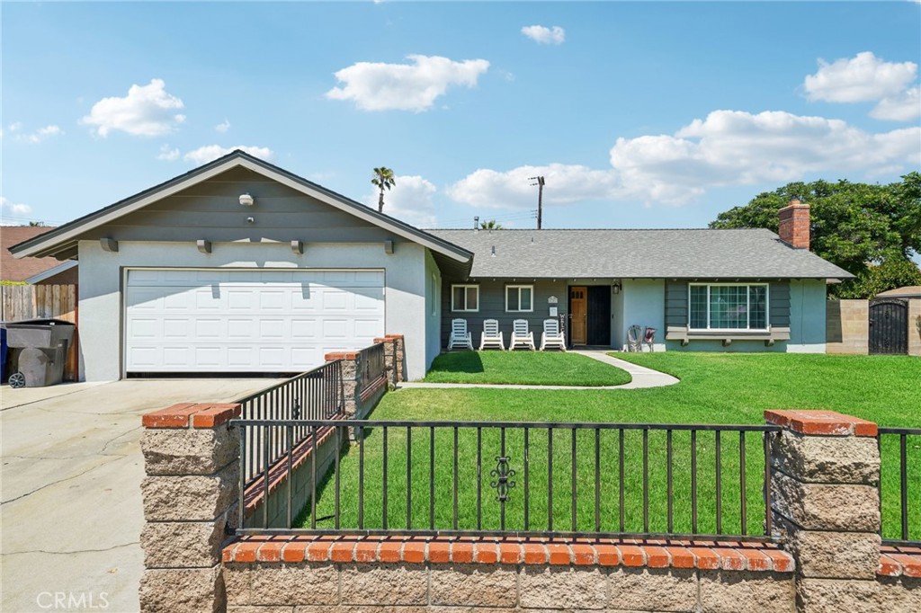 4141 Lafayette Street Riverside, CA 92503 - Photo 1 of 1 a front view of a house with garden