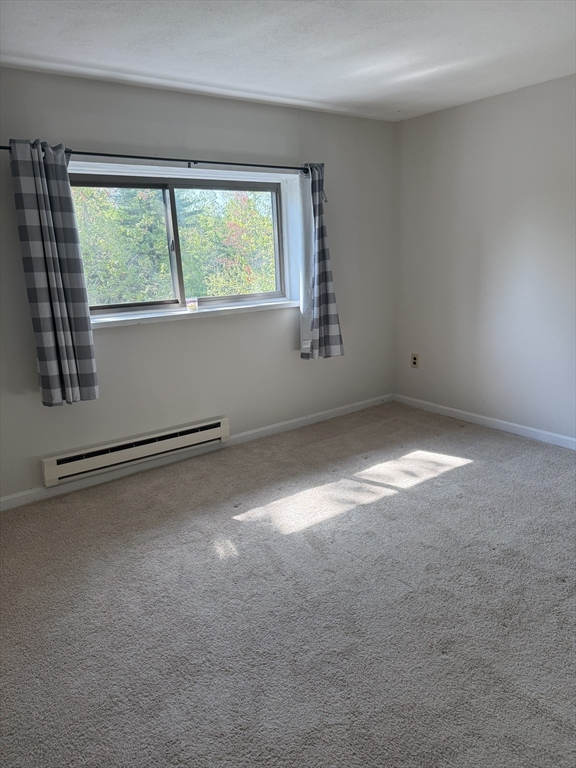 310 Codman Hill Road, Unit 34D Boxborough, MA 01719 - Photo 11 of 17 a view of empty room with window