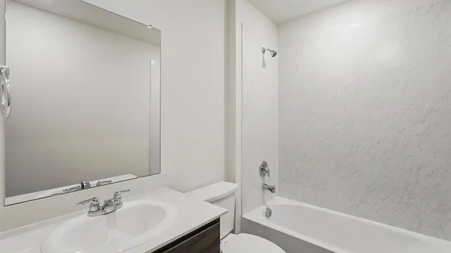 a bathroom with a sink and a bathtub