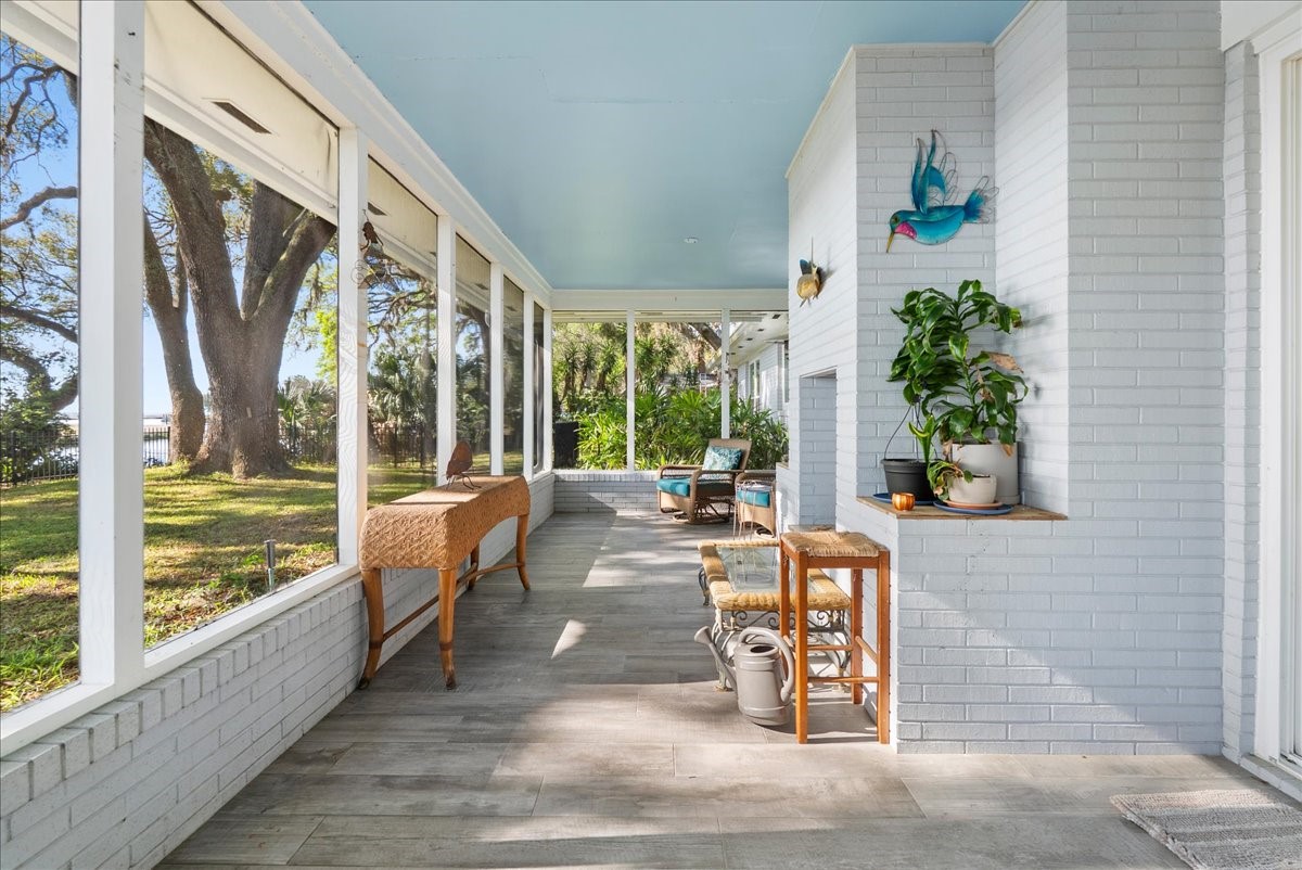85316 Avant Road Yulee, FL 32097 - Photo 39 of 62 Screened Waterfront Porch with Fireplace