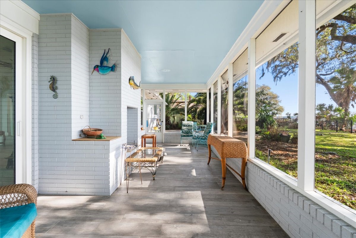 85316 Avant Road Yulee, FL 32097 - Photo 40 of 62 Screened Waterfront Porch with Fireplace