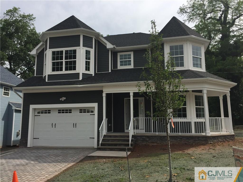 140 Dover Road Colonia, NJ 07067 - Photo 1 of 14 a front view of a house with a garage