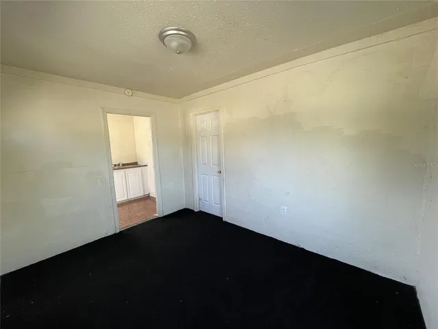 a view of an empty room and window