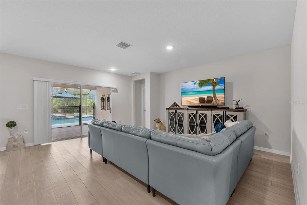 12952 Wellspring Drive Lithia, FL 33547 - Photo 12 of 46 a living room with furniture and a large window