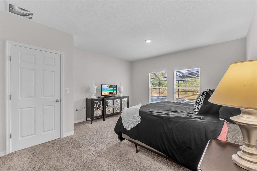 12952 Wellspring Drive Lithia, FL 33547 - Photo 15 of 46 a bed room with a bed and a window