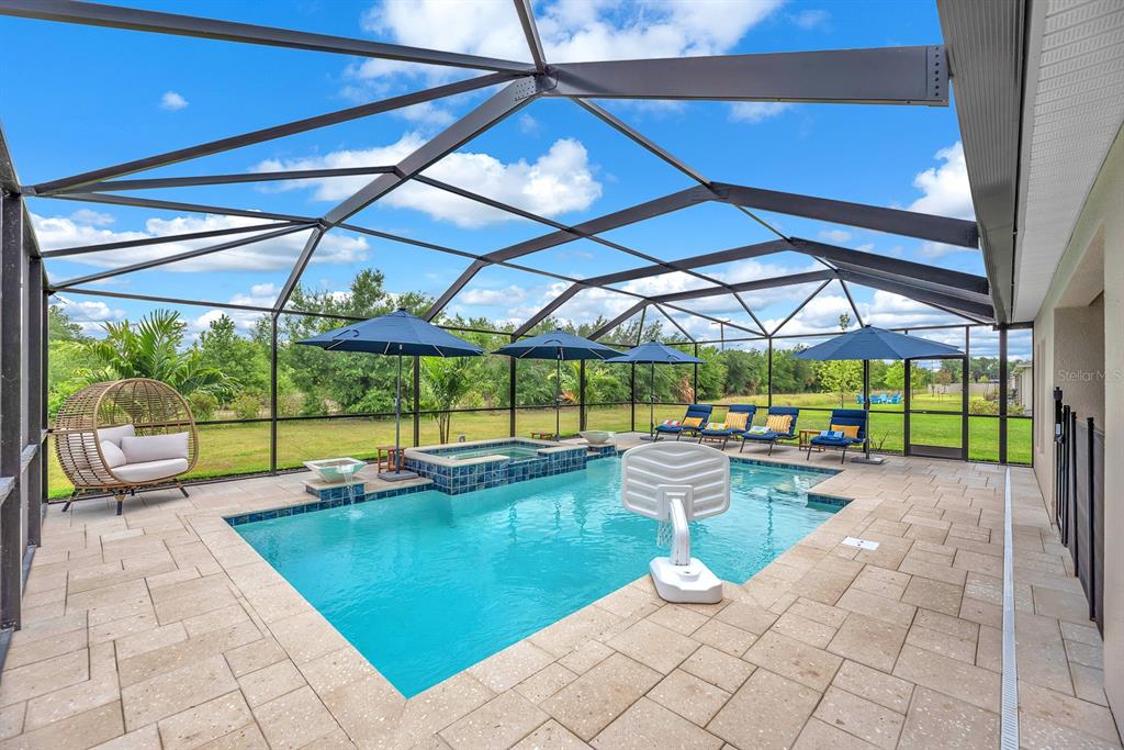 12952 Wellspring Drive Lithia, FL 33547 - Photo 2 of 46 a view of a swimming pool with a porch