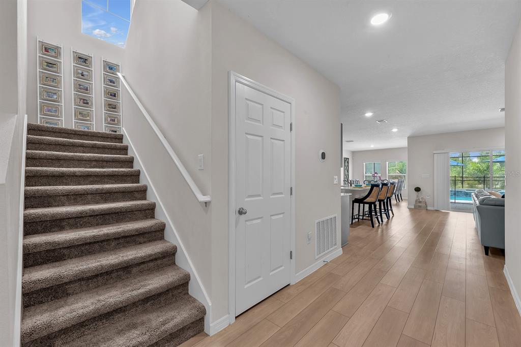 12952 Wellspring Drive Lithia, FL 33547 - Photo 21 of 46 a view of entryway and hall with wooden floor