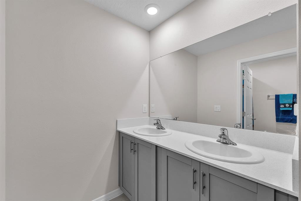 12952 Wellspring Drive Lithia, FL 33547 - Photo 27 of 46 a bathroom with a sink and a mirror