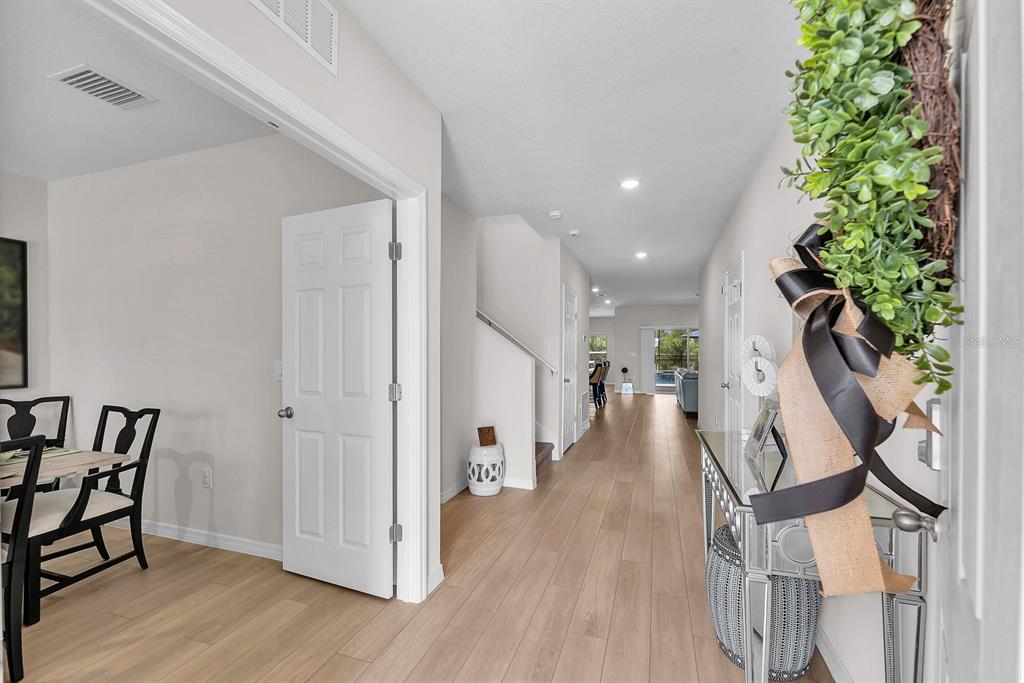 12952 Wellspring Drive Lithia, FL 33547 - Photo 3 of 46 a view of entryway and hall with wooden floor