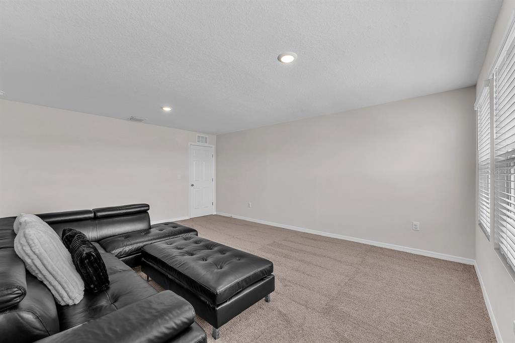 12952 Wellspring Drive Lithia, FL 33547 - Photo 32 of 46 a view of a room with furniture and a window