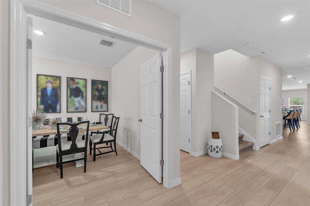 12952 Wellspring Drive Lithia, FL 33547 - Photo 4 of 46 a view of a dining room with furniture and wooden floor